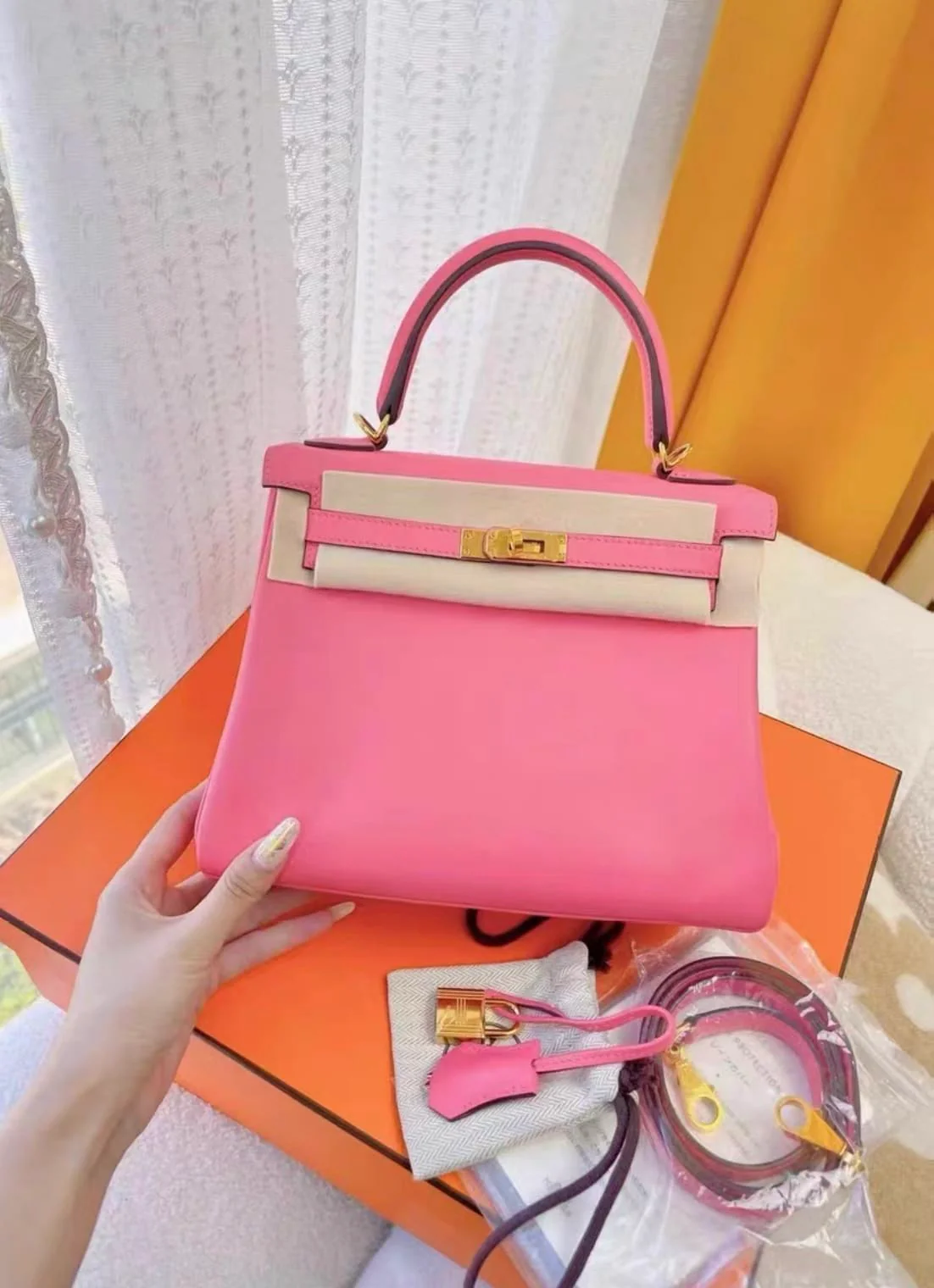 Hermes Kelly 25 pink Swift leather gold hardware