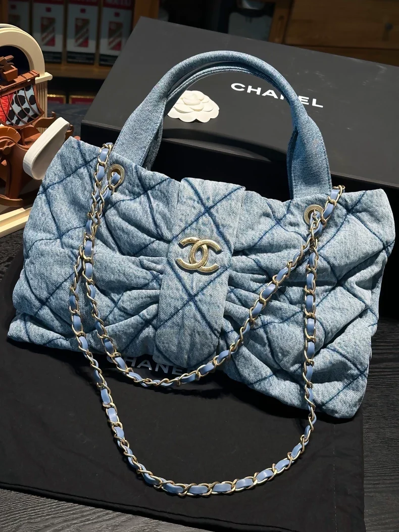 Chanel 25 light blue denim bow bag with gold hardware chain