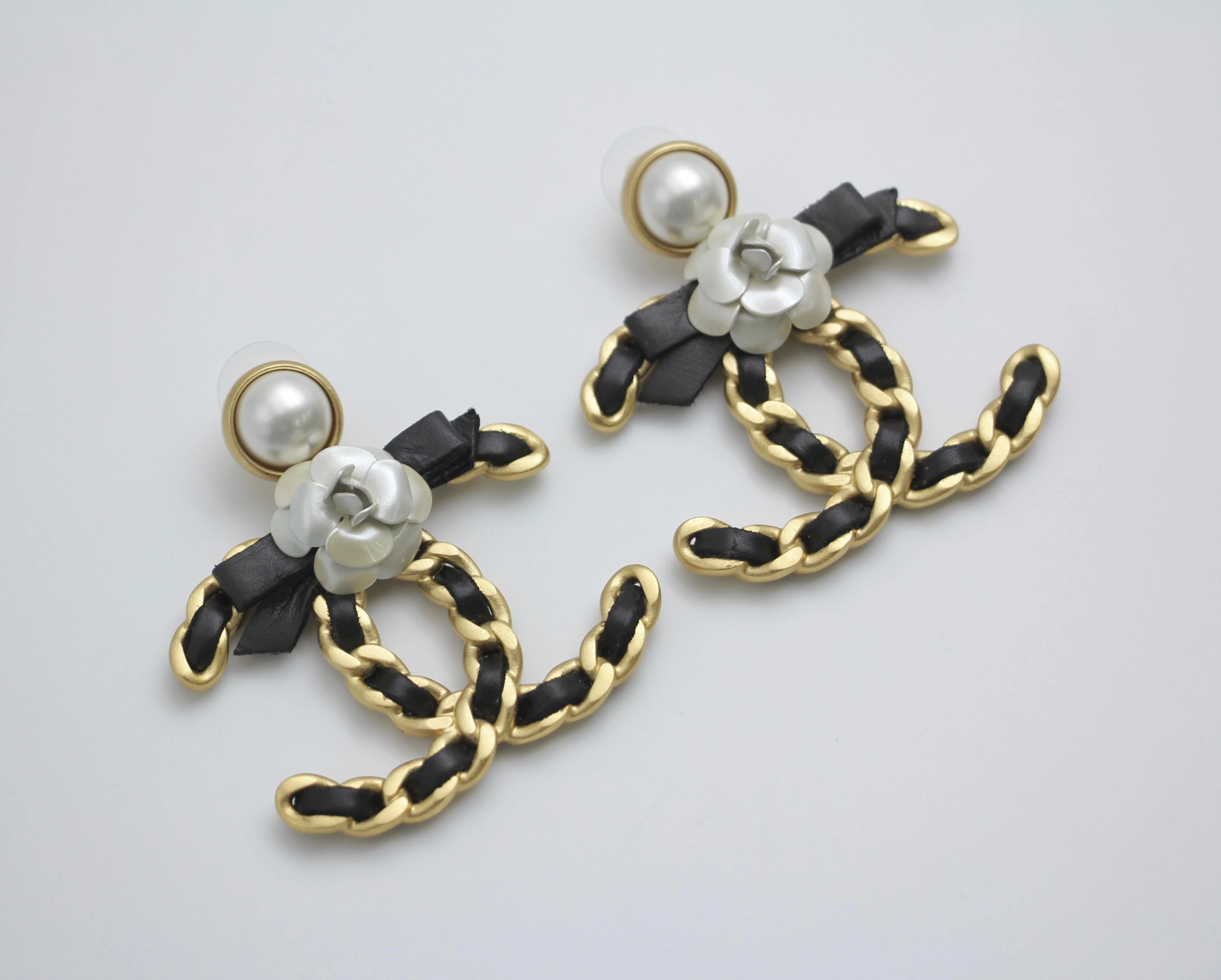 Chanel 20A Metal Leather Bow Camellia Earrings