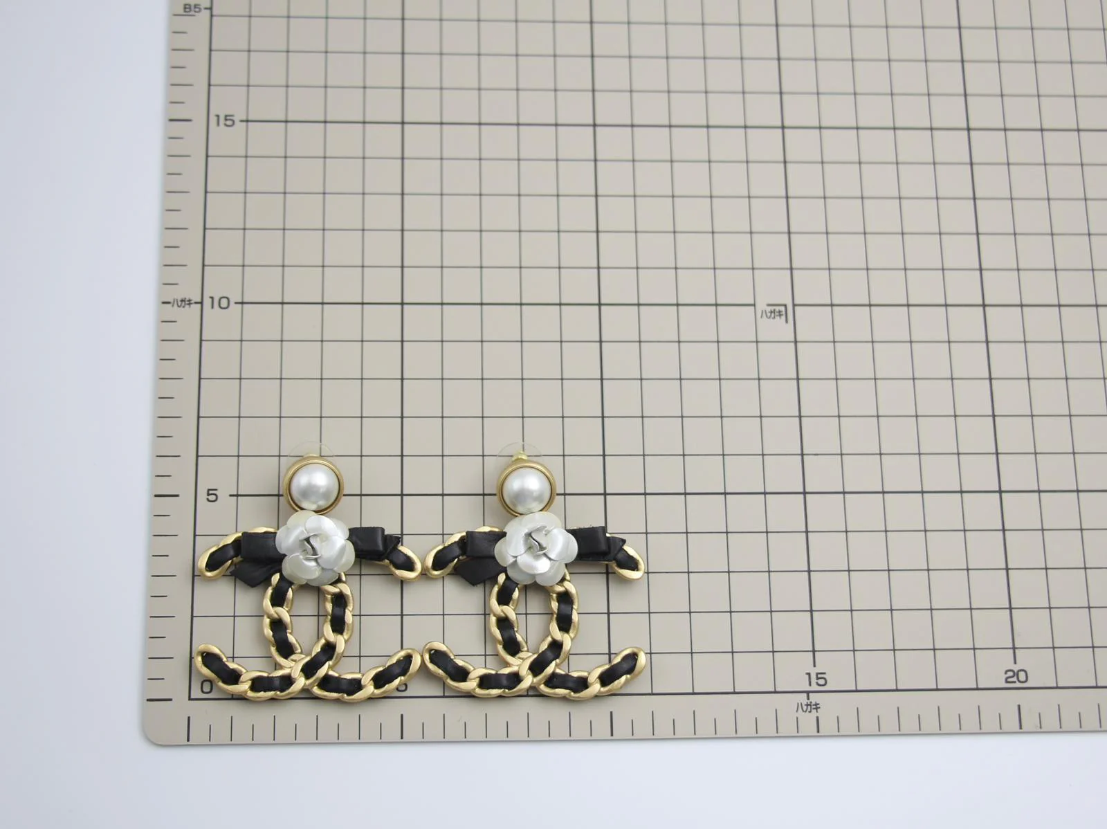 Chanel 20A Metal Leather Bow Camellia Earrings - Image 8