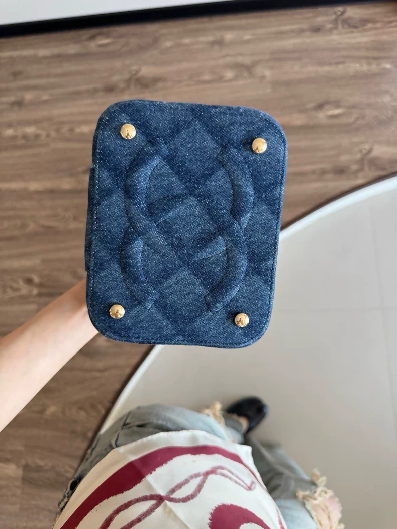 Chanel 22 makeup bag with a dark denim handle and chain - Image 3