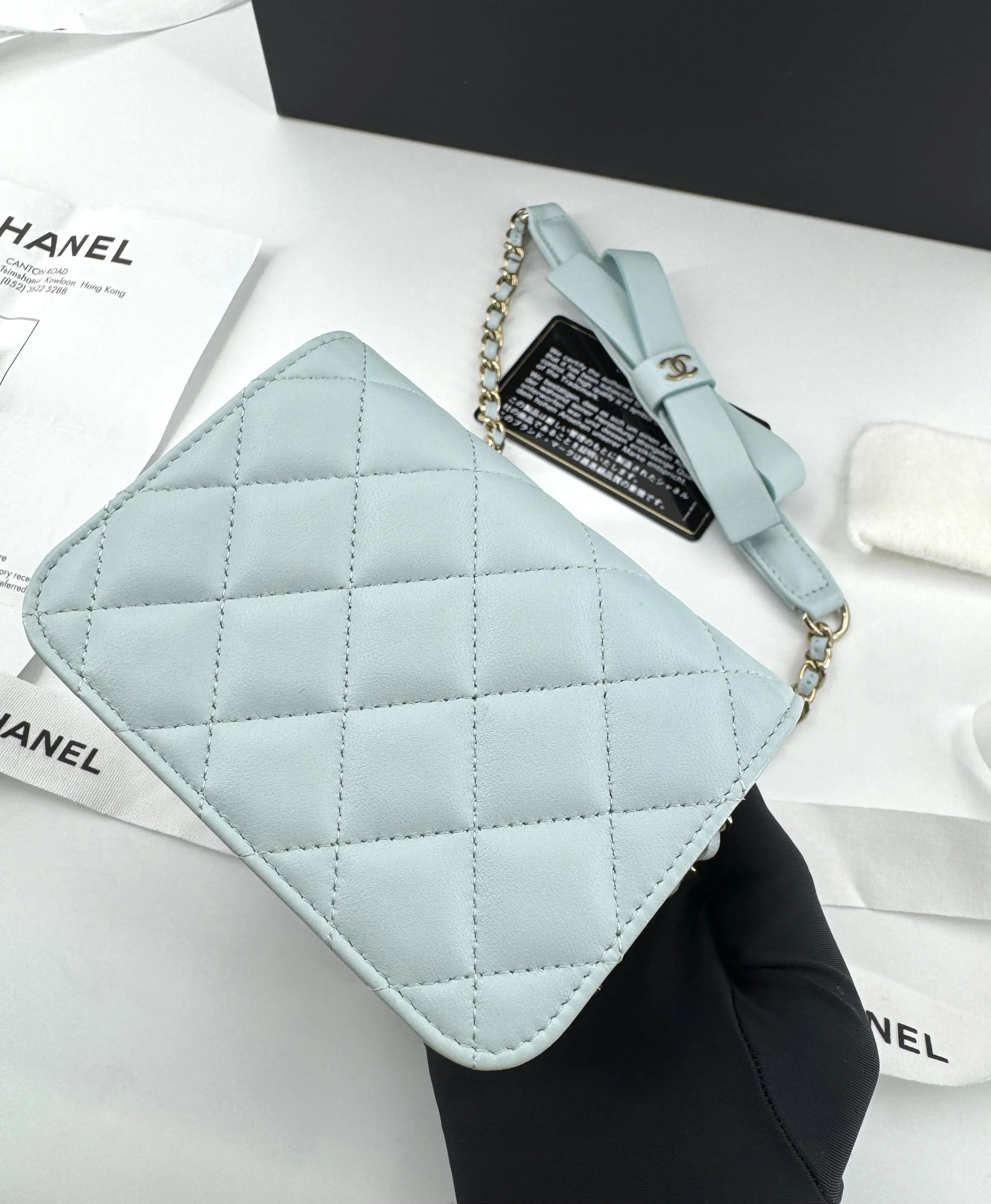 Chanel baby blue quilted leather coin purse with gold chain strap and a bow - Image 11