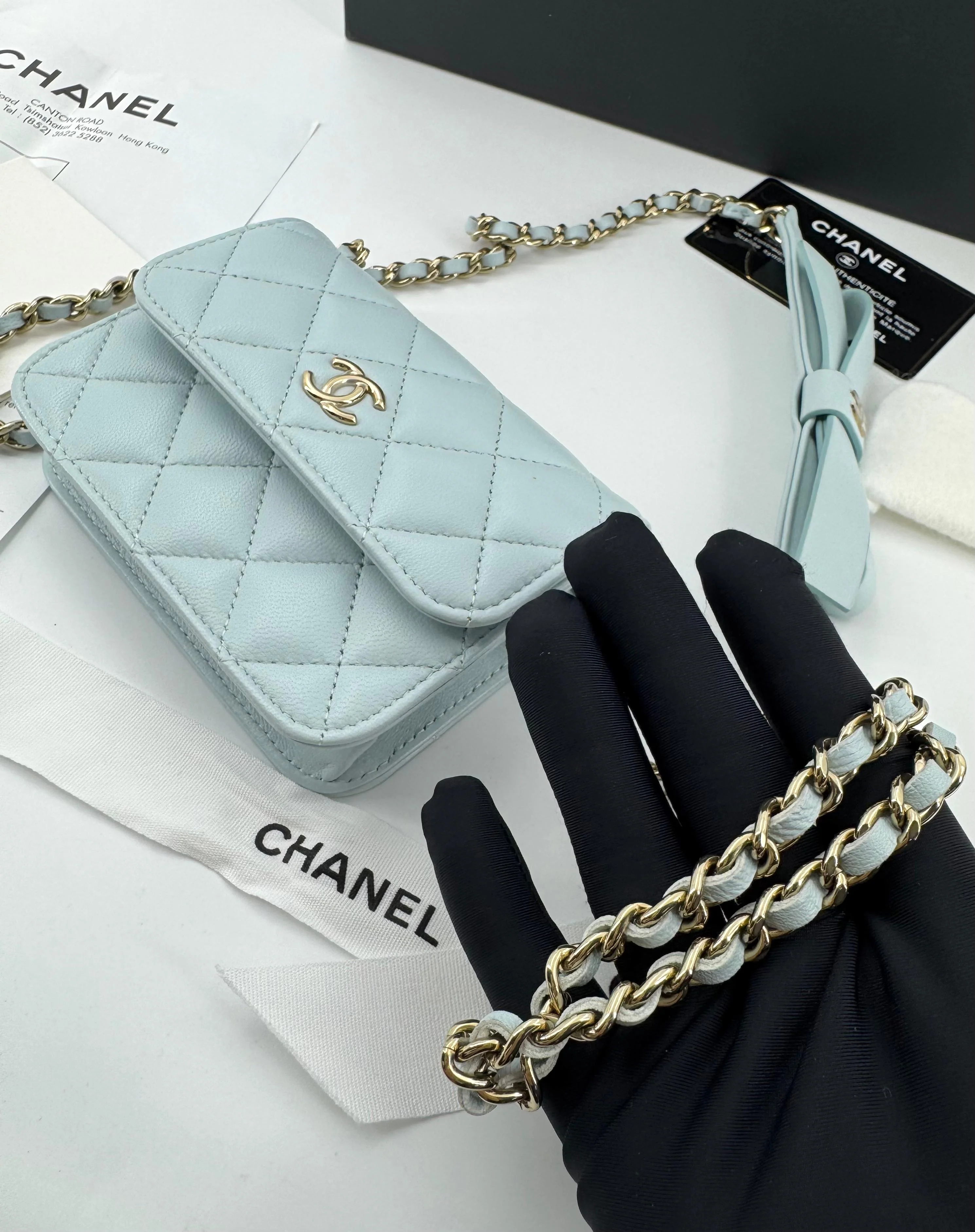 Chanel baby blue quilted leather coin purse with gold chain strap and a bow - Image 7