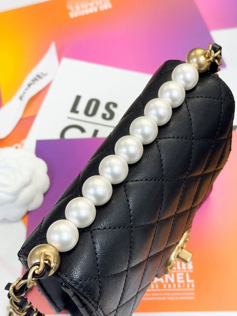 Chanel, black quilted pearl-trimmed vertical chain bag, - Image 2