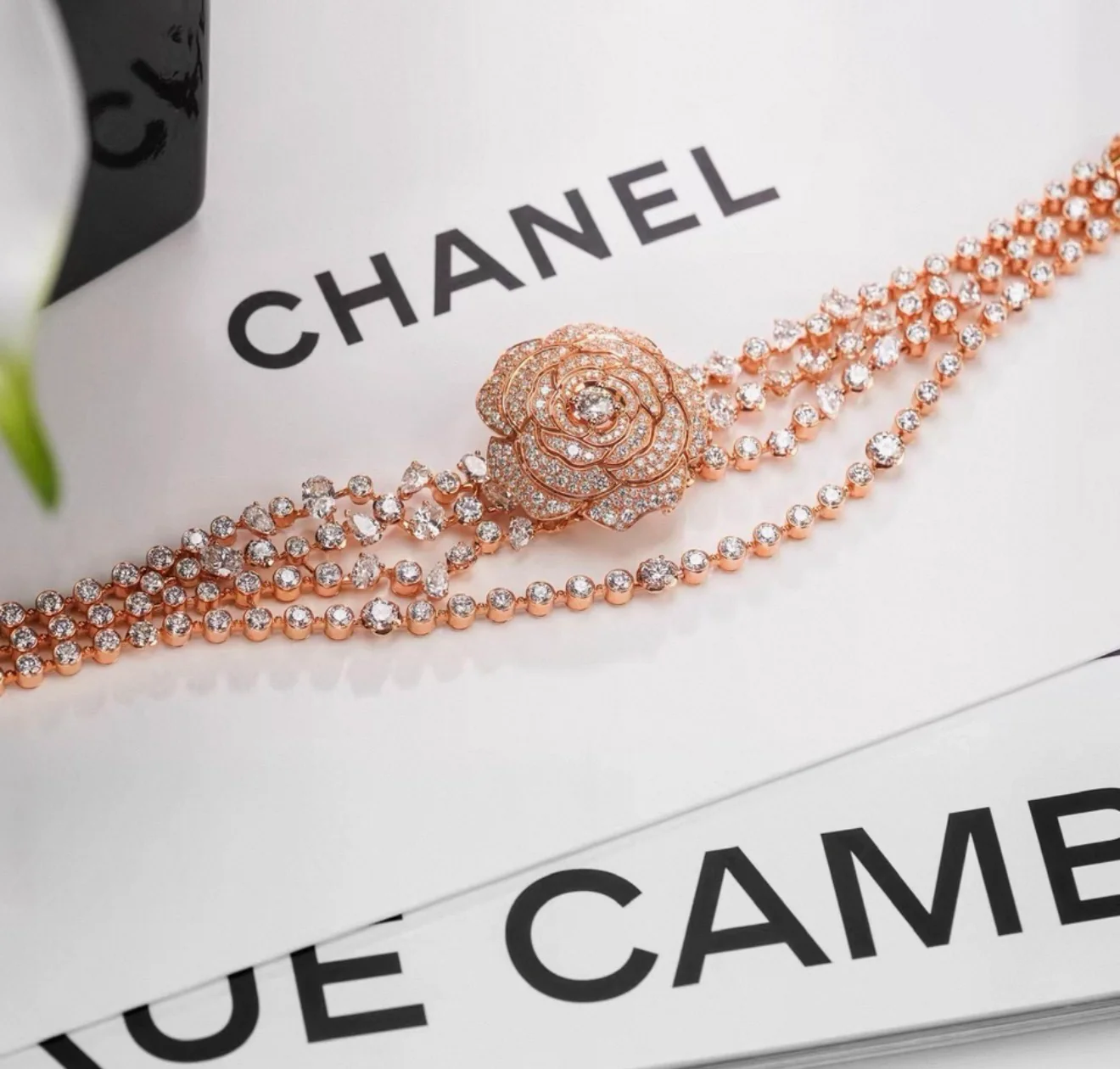 Chanel "Camélia Garden" high jewelry collection features a rose gold tassel chain with full diamonds, detachable camellia brooch, bracelet, and bangle. - Image 3