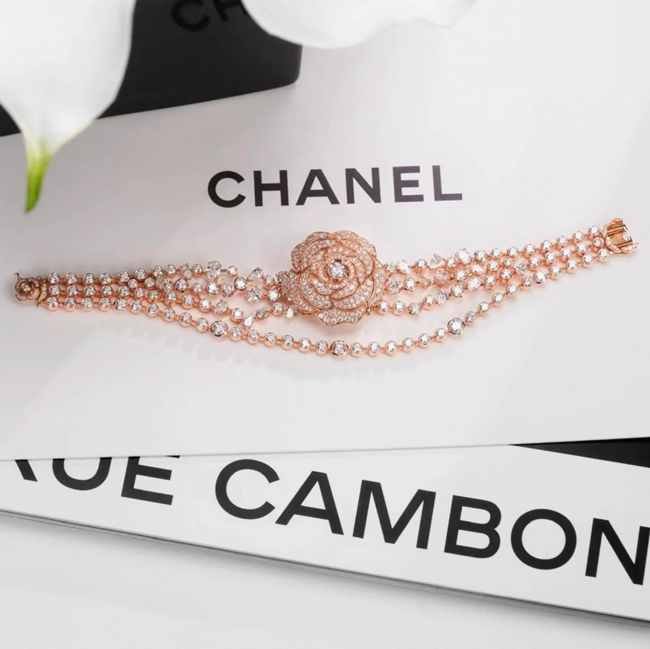Chanel "Camélia Garden" high jewelry collection features a rose gold tassel chain with full diamonds, detachable camellia brooch, bracelet, and bangle. - Image 4