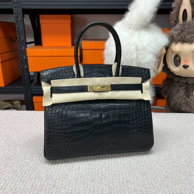 Hermes Birkin 30 black and gold matte crocodile leather gold hardware