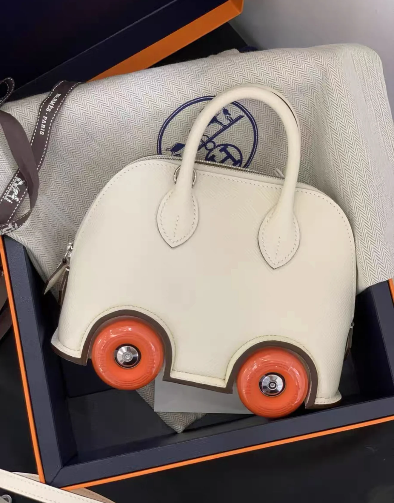 Hermès Bolide on Wheel Nata/Orange Epsom Leather Palladium Hardware