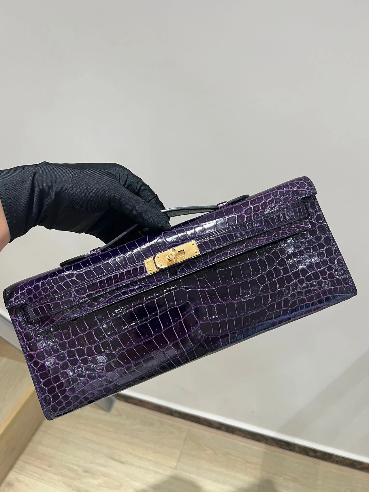 Hermes Kelly cut purple shiny crocodile leather gold hardware