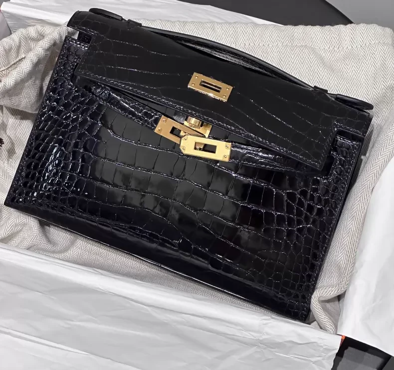 Hermes kelly pochette black shiny crocodile leather gold hardware