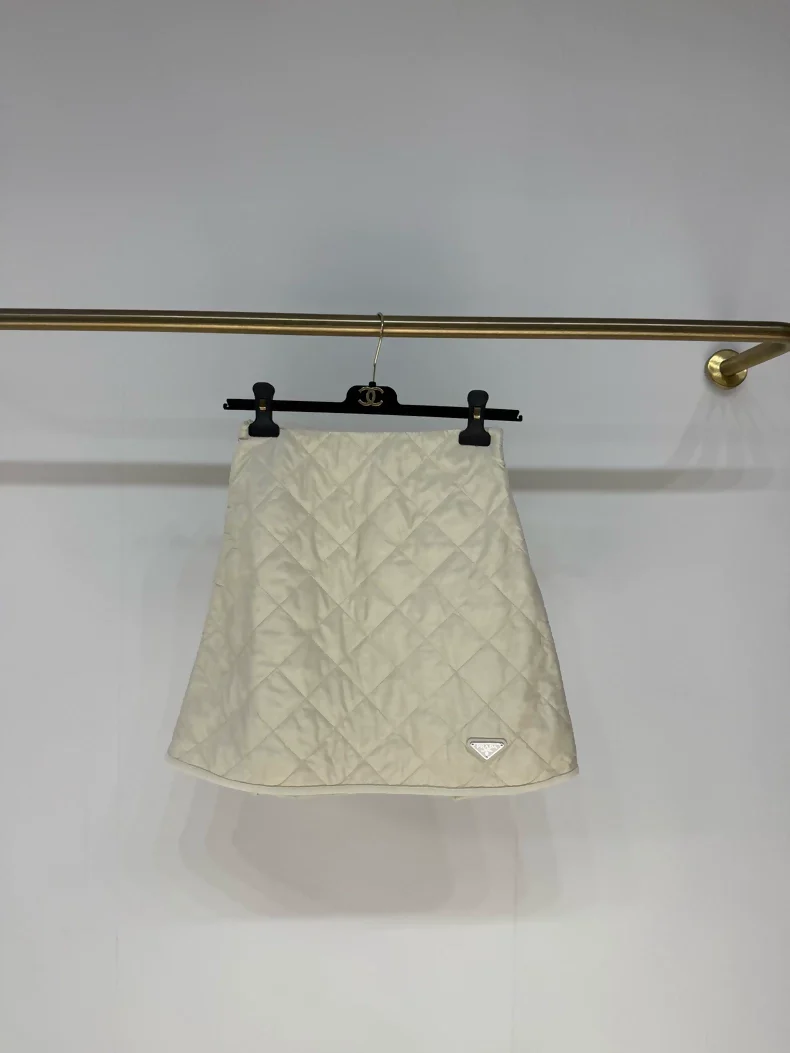 Prada 2025 skirt in cream white nylon with diamond pattern and triangular logo
